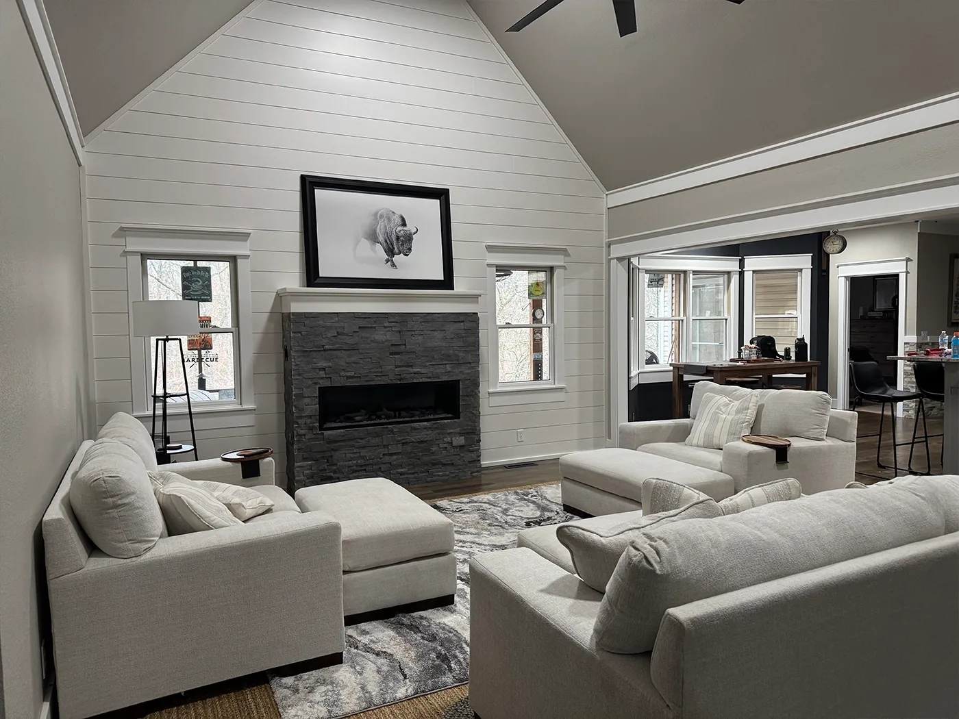 Vaulted living room interior repaint with stone fireplace